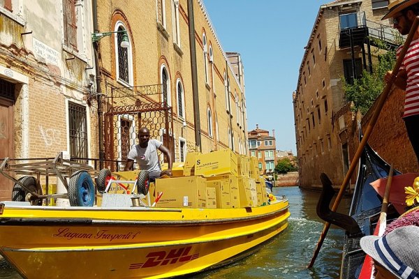 Warehouse worker efficiently picking items from organized sh