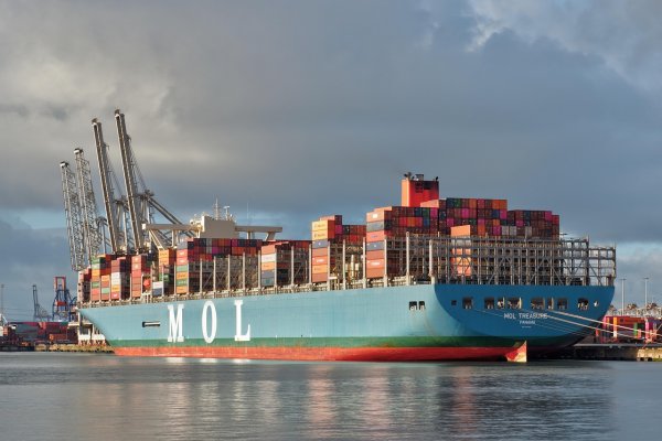 Small business owner reviewing inventory management in moder